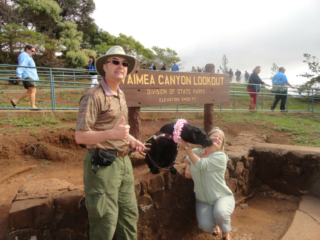 Guidedogs for the Blind travel expert Diana Saint James with guide dog Freya and Mike at Waimea Canyon