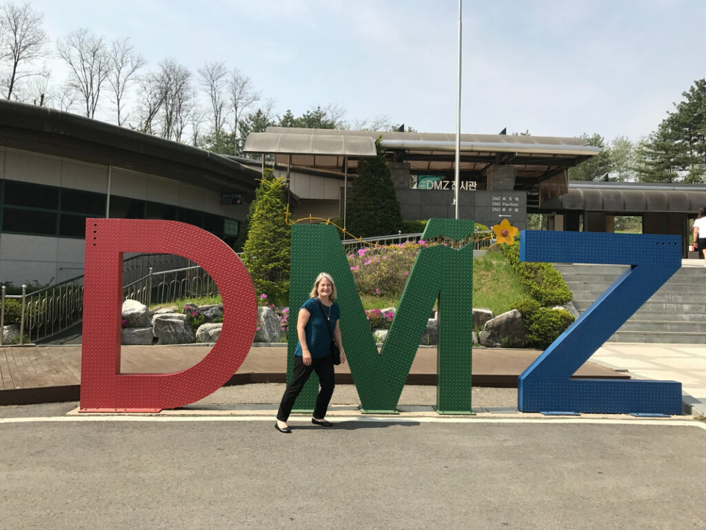 DMZ Signage Demilitarized Zone with Diana Saint James, Travel Agent.