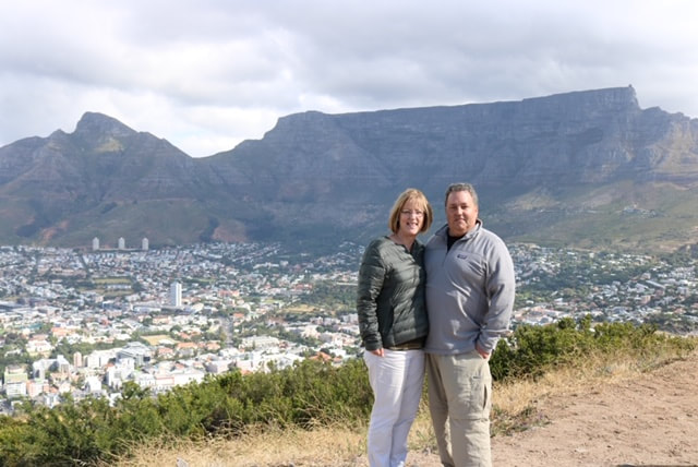 In front of the Table Mountain in South Africa with Jill Romano Travel Consultant